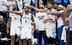 The Wolves react to the play of their teammates in the fourth quarter of Saturday's Game 1 victory over Phoenix.