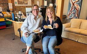 Amy Thielen, left, and Heidi Holtan after their debut episode of "Ham Radio" celebrating with homemade rhubarb pie and drinking "Wally Wine."