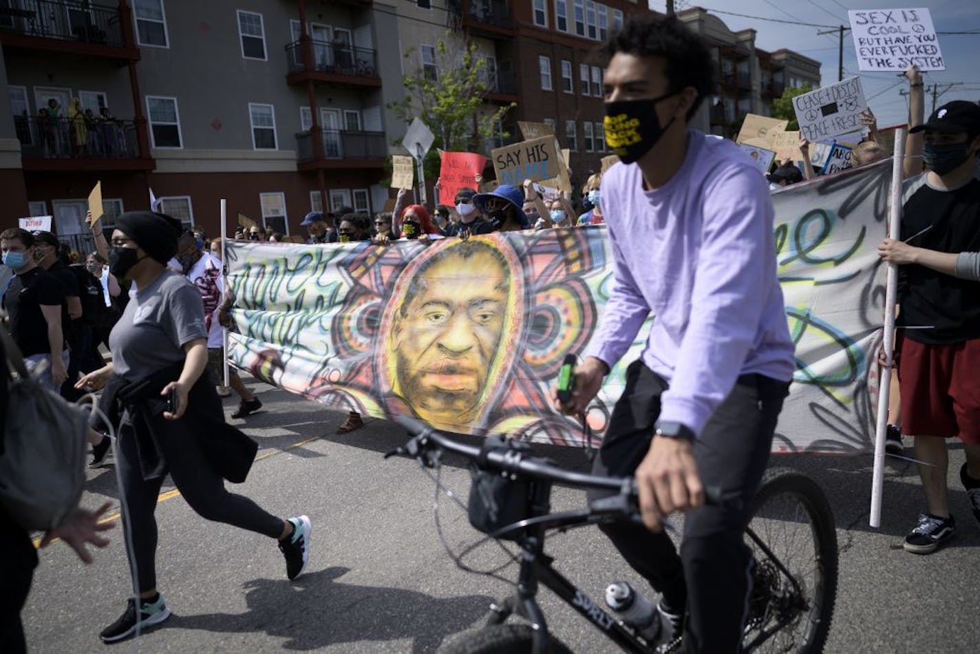 Demonstrators made their way down University Avenue from the Minneapolis police union headquarters toward Mayor Jacob Frey's home Saturday.