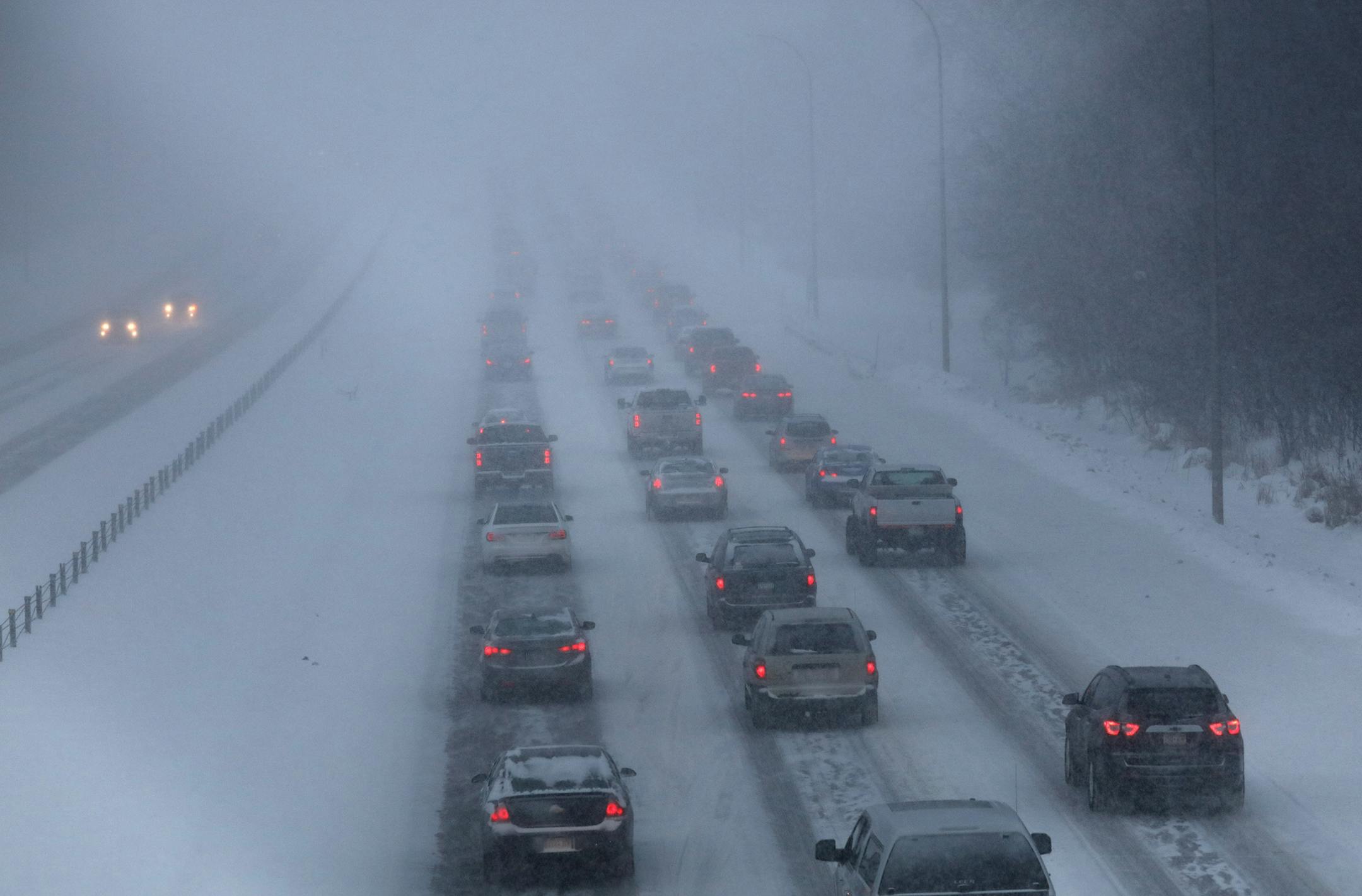 Cars are moving slowly during the morning commute as snow continues to fall. This is traffic south of Hanson Blvd on Hwy 10 in Coon Rapids Wednesday morning. ] Daid Deney Star Tribune 2/20/19