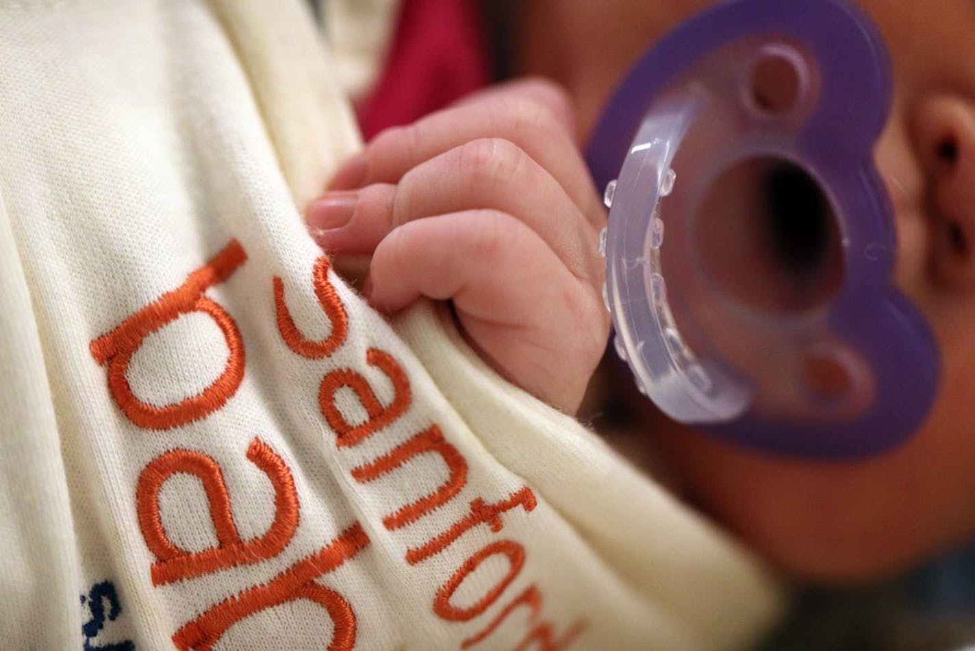 A baby with neonatal abstinence syndrome, a condition newborns experience when withdrawing from exposure to narcotics in utero, slept in the special care nursery at the Sanford Bemidji Medical Center.