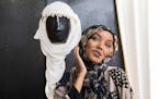 Halima Aden playfully poses with a bridal hijab at Sabrina's Bridal Shop. ] LEILA NAVIDI ï leila.navidi@startribune.com BACKGROUND INFORMATION: Halim