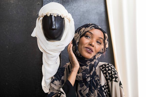 Halima Aden playfully poses with a bridal hijab at Sabrina's Bridal Shop. ] LEILA NAVIDI ï leila.navidi@startribune.com BACKGROUND INFORMATION: Halim