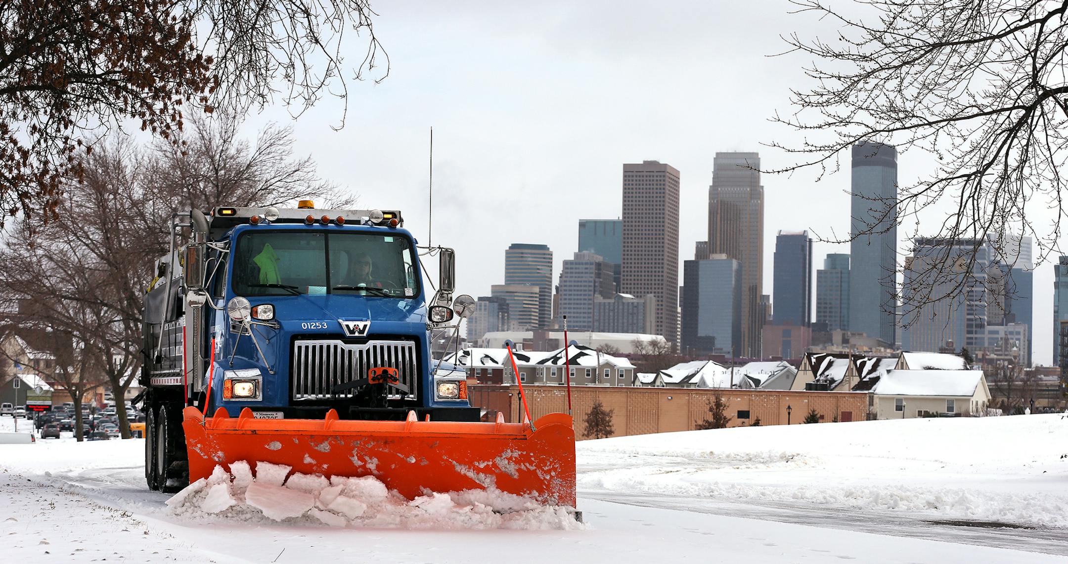 City of Minneapolis truck driver Vicky Stich plows snow and lays down sand and salt on Olson Highway Service Road in Minneapolis on Tuesday, November 11, 2014. Stich has been driving a truck for the city for 38 years. ] LEILA NAVIDI leila.navidi@startribune.com /