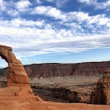FILE - Delicate Arch is seen at Arches National Park on April 25, 2021, near Moab, Utah. As the world nears its third year of the COVID-19 pandemic, there is at least one industry that is bouncing back — Utah travel and tourism. (AP Photo/Lindsay Whitehurst, File)