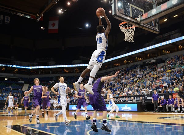 Minneapolis North guard Tyler Johnson (10) dunked the ball off an alley oop pass in the first half against Goodhue Saturday. ] (AARON LAVINSKY/STAR TR