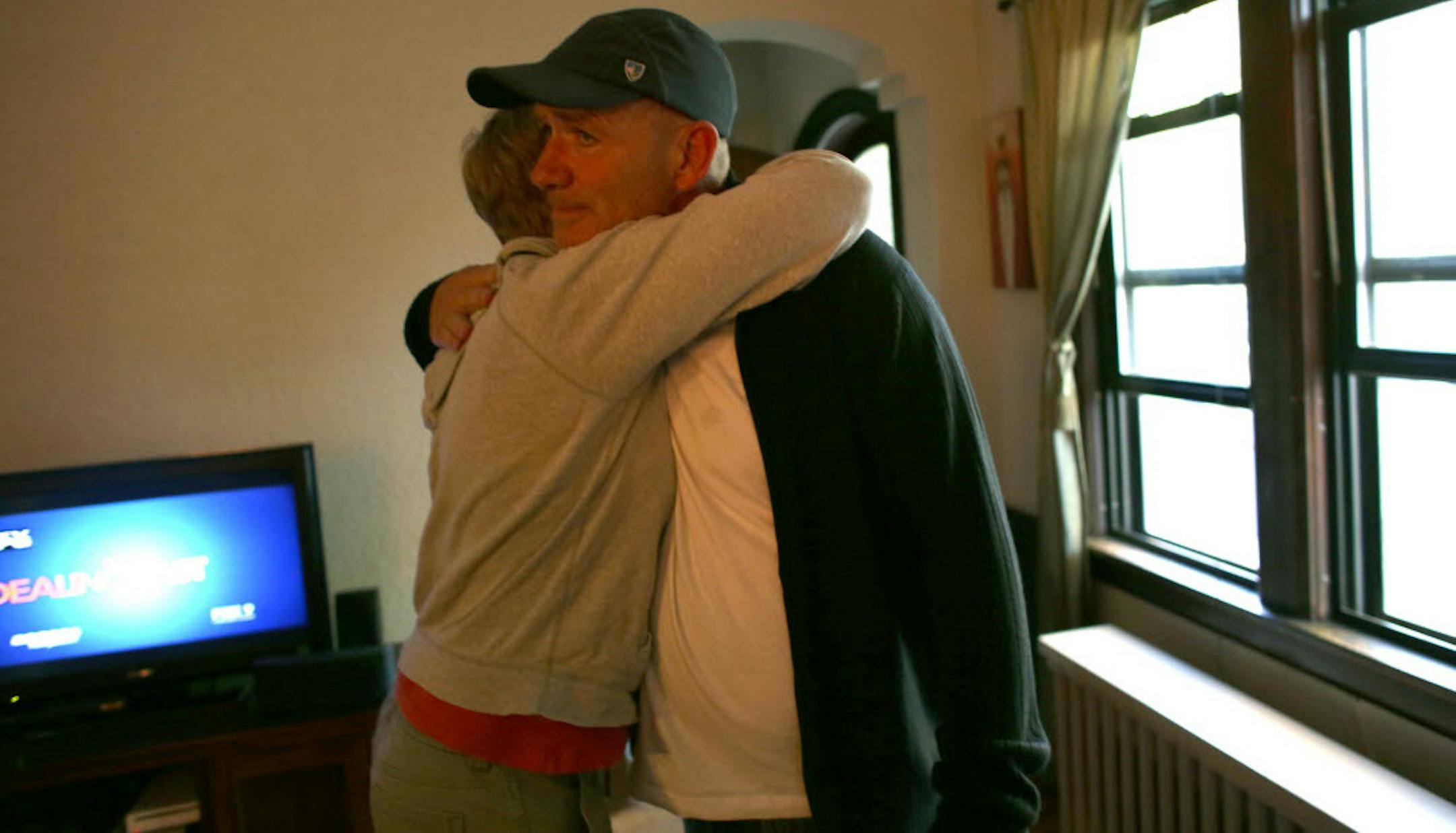 Jack O'Leary, father of Isabel Marie Ward, 13, got a hug from friend Susie Rockafellow before leaving to hand out flyers as family and friends searched for Ward and four other missing girls from Seward Montessori School.