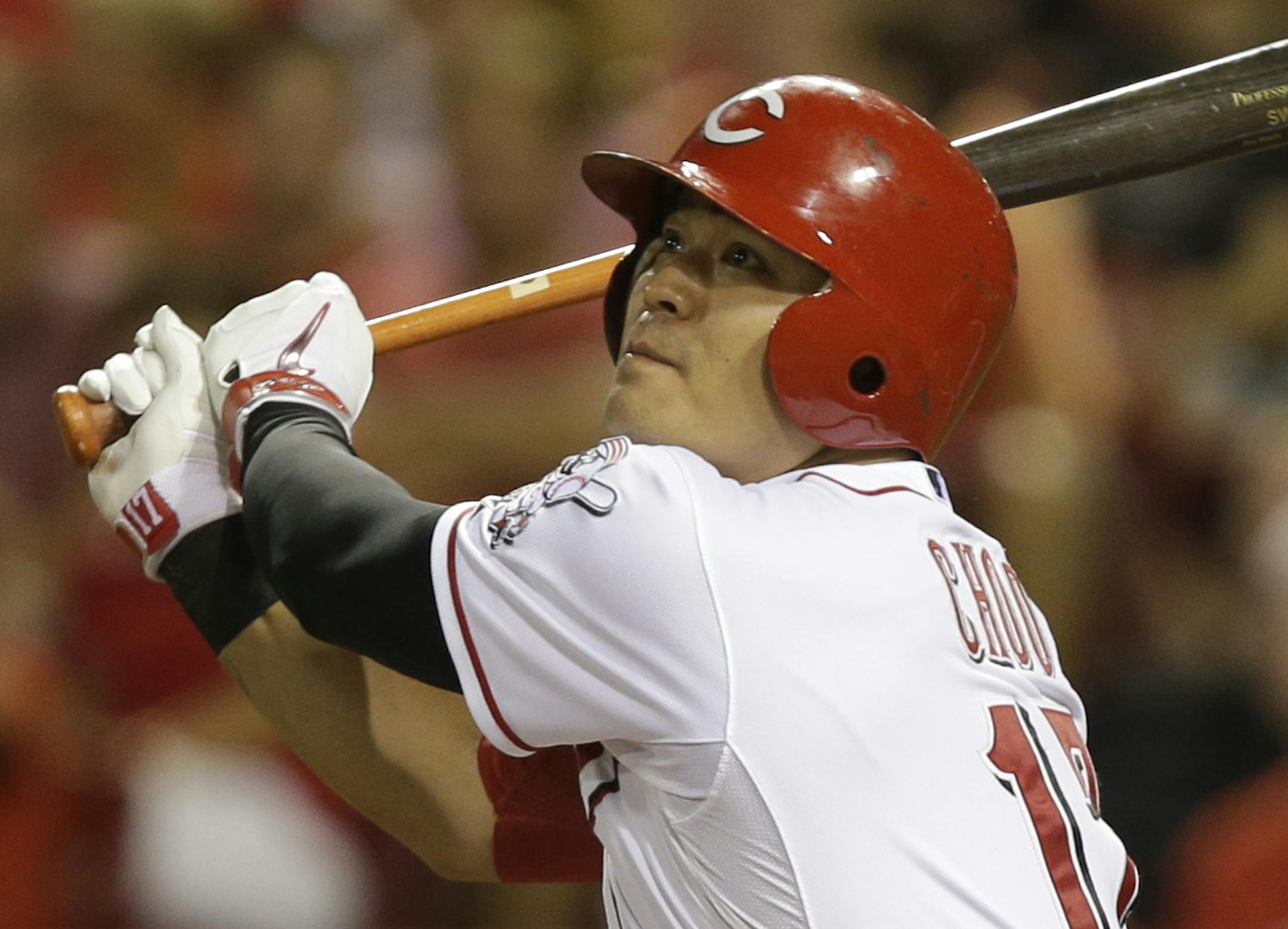 FILE - In this Aug. 23, 2013 file photo, Cincinnati Reds' Shin-Soo Choo flies out to left field in the seventh inning of a baseball game against the Milwaukee Brewers, in Cincinnati. On the first deadline day of the offseason, teams had until 5 p.m. to make $14.1 million qualifying offers to their eligible free agents, a group that includes Robinson Cano, Jacoby Ellsbury, Carlos Beltran and Shin-Soo Choo. (AP Photo/Al Behrman, File) ORG XMIT: MIN2013110618414876