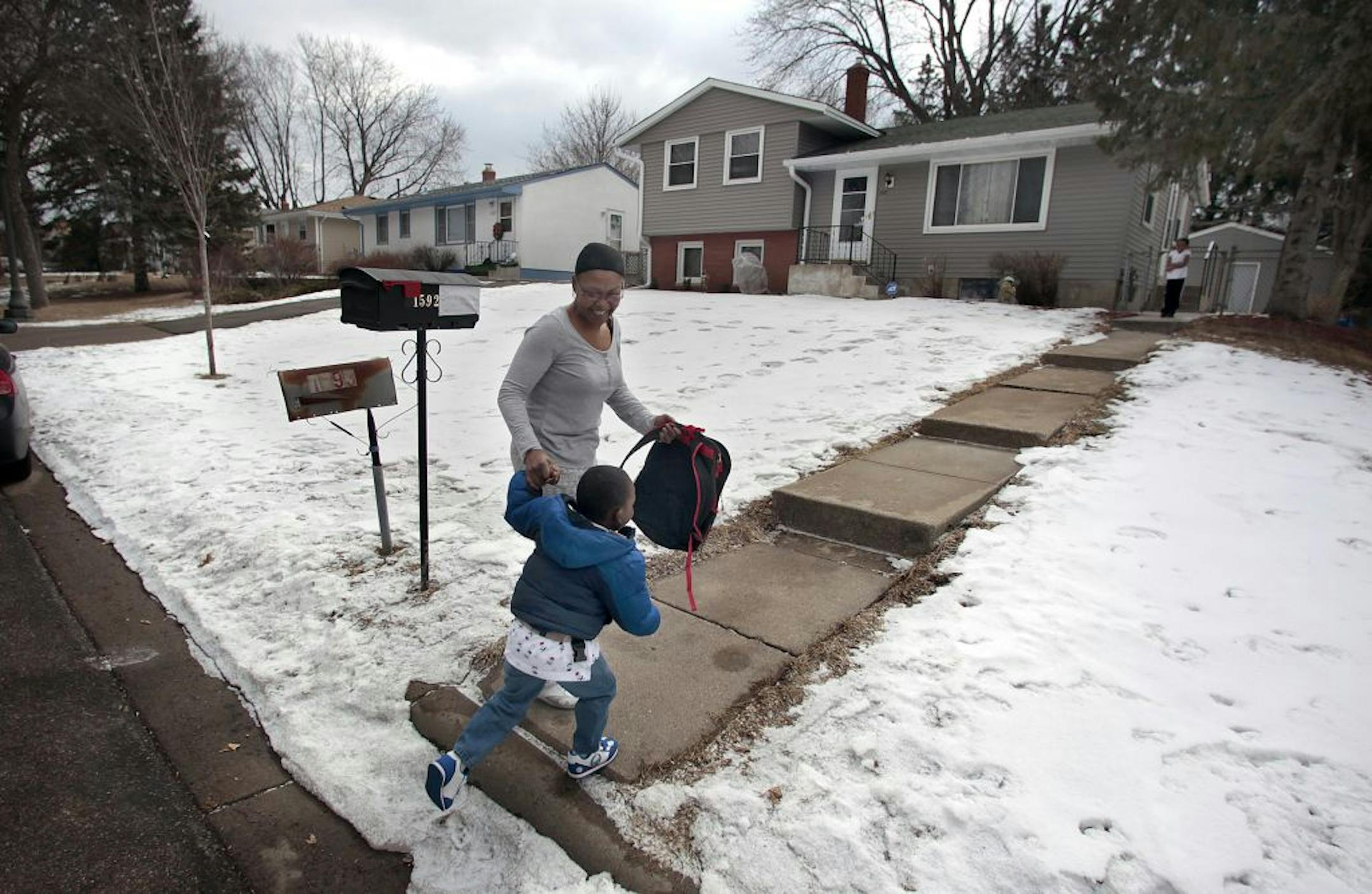 Deann Gayles walked her grandson, Tru Merriman, 3, from a school bus and to the family's St. Paul home. Tru was coming home from morning pre-school.