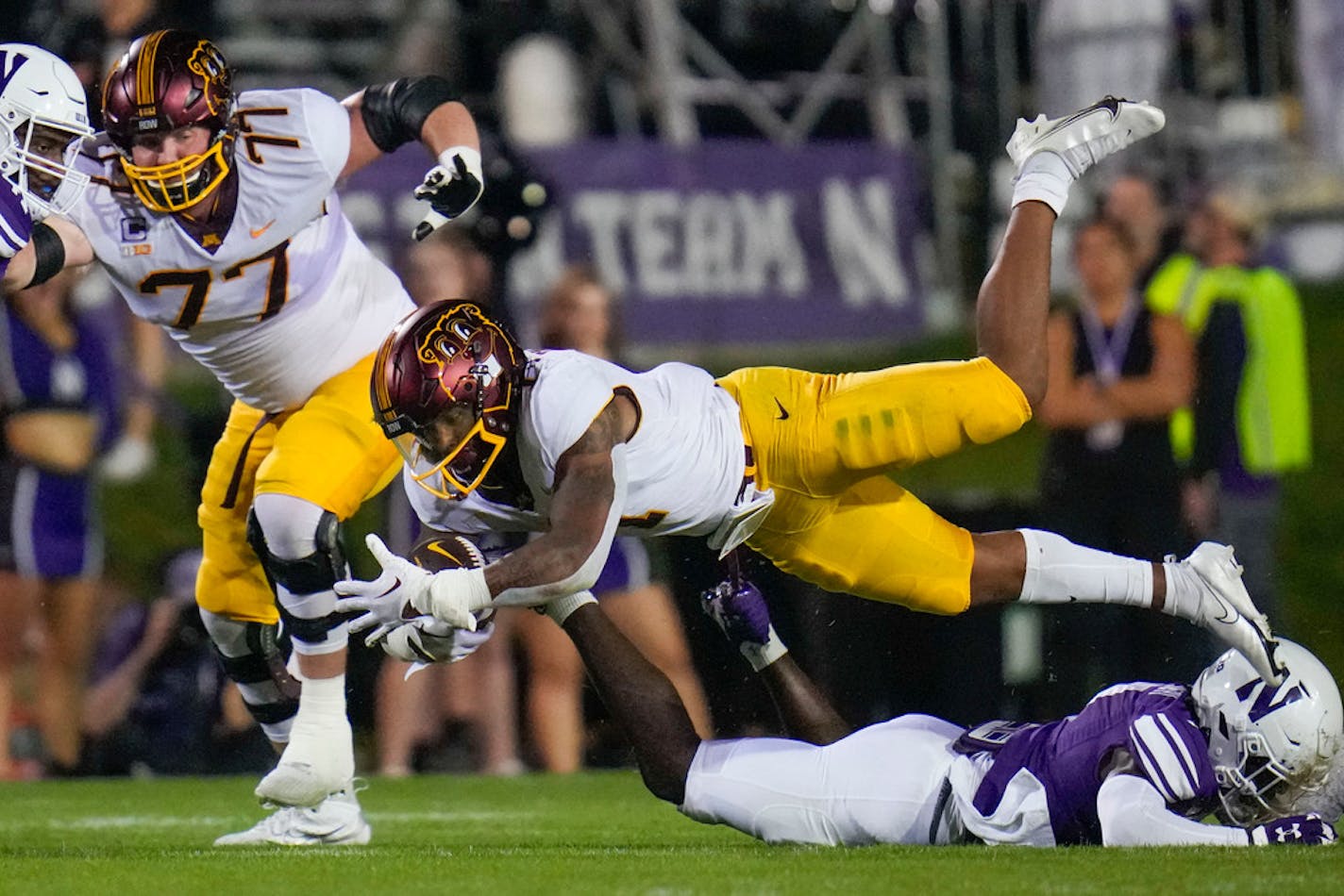 Minnesota running back Darius Taylor hangs onto the ball as he dives during the first half of an NCAA college football game against Northwestern, Saturday, Sept. 23, 2023, in Evanston, Ill. (AP Photo/Erin Hooley)