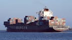 In this Wednesday, Aug. 31, 2016, photo, the container ship Hanjin Montevideo leaves the Hanjin Terminal and the Port of Long Beach in Long Beach, Cal