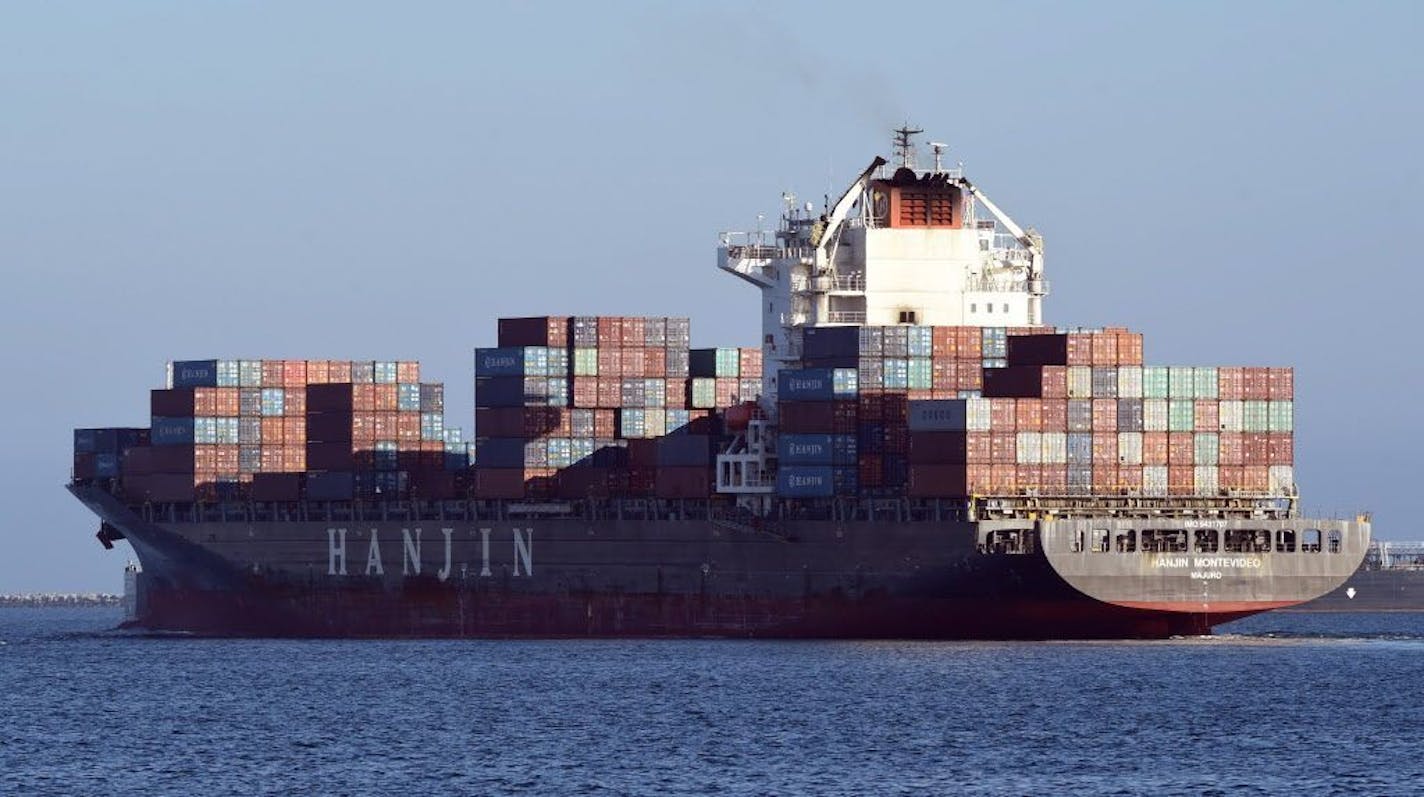 In this Wednesday, Aug. 31, 2016, photo, the container ship Hanjin Montevideo leaves the Hanjin Terminal and the Port of Long Beach in Long Beach, Calif. Hanjin has filed for bankruptcy and the ship Hanjin Montevideo is to be anchored inside the breakwater.