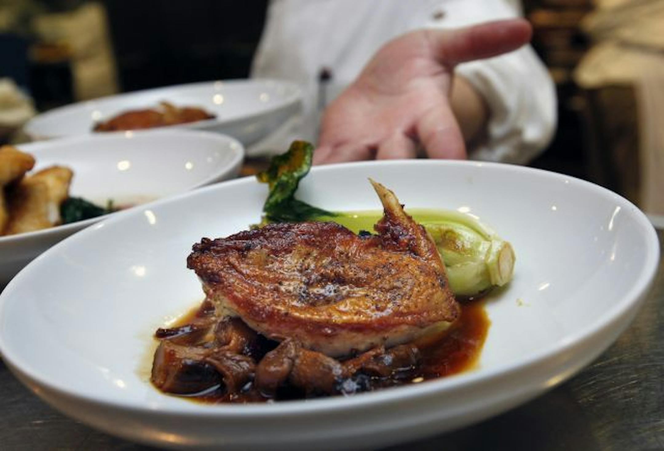 Pheasant, pan-roasted in duck fat, with mushrooms and bok choy.
