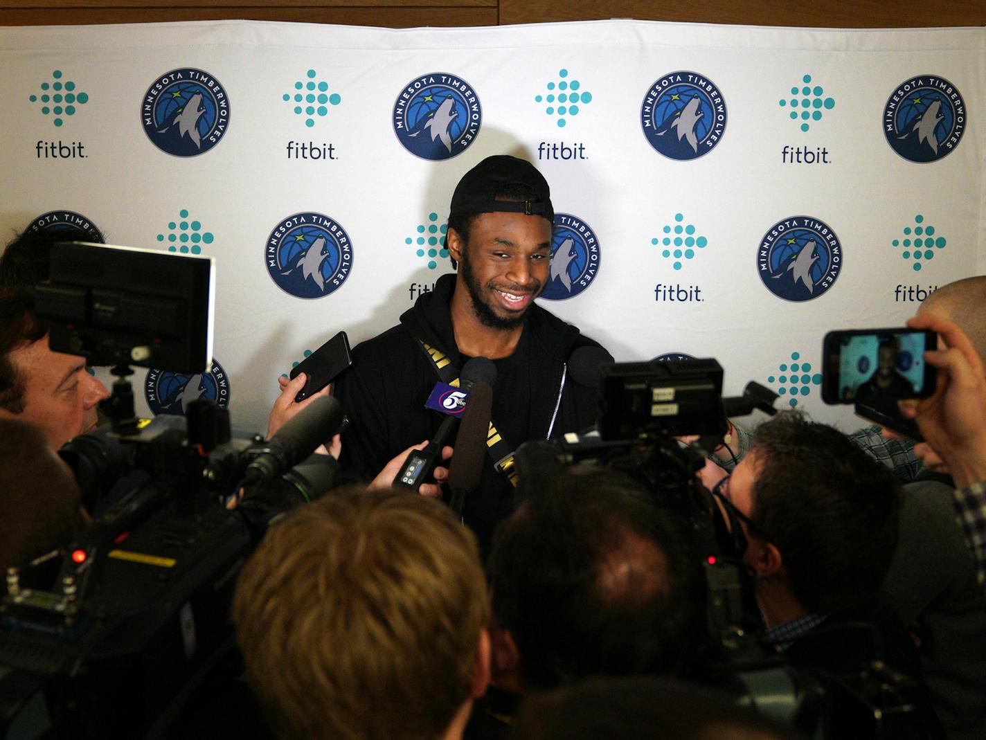 Andrew Wiggins, taking questions following Tuesday's news conference, is among a group of Wolves players already working out together at Target Center.