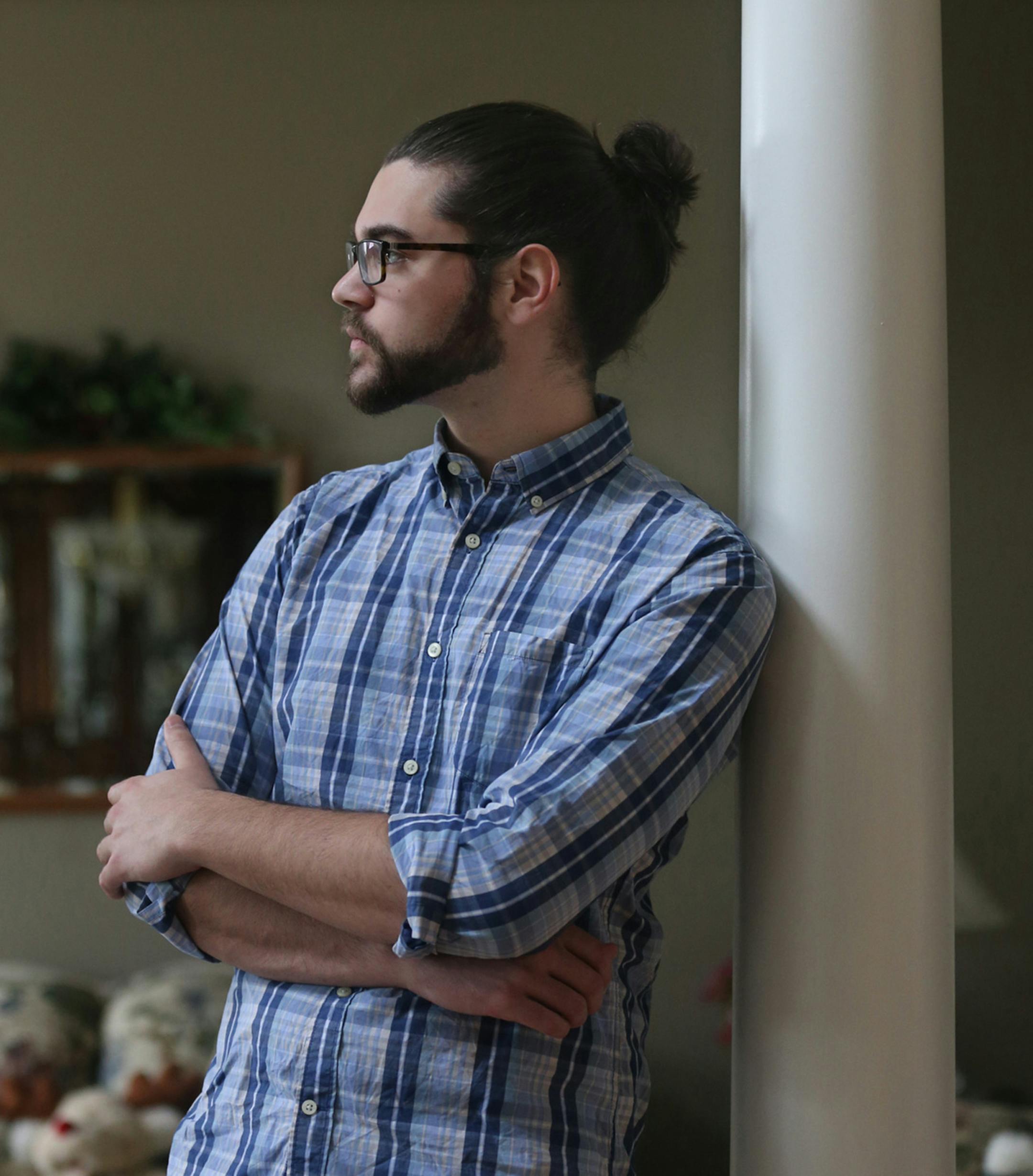 Josh Froats, 19, a sophomore chemical engineering major at Ohio State University, with his hair in a bun at his parents home on Wednesday, Dec. 30, 2015 in Sharon Township, Ohio. (Phil Masturzo/Akron Beacon Journal/TNS) ORG XMIT: 1179824