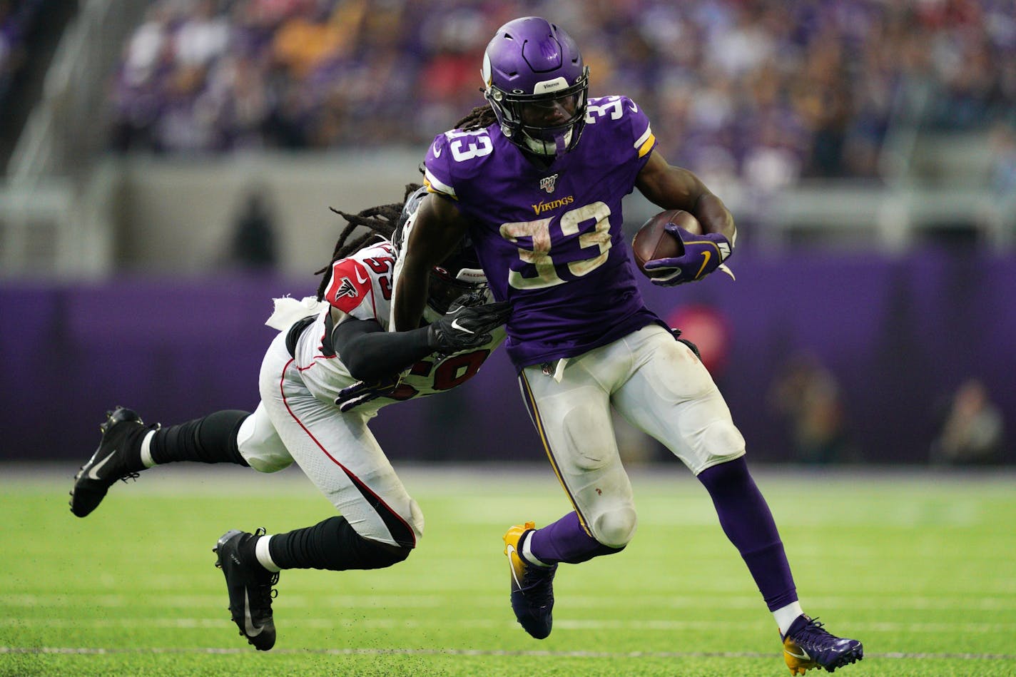 Atlanta Falcons outside linebacker De'Vondre Campbell (59) dove after Minnesota Vikings running back Dalvin Cook (33) as he ran the ball in the second half.