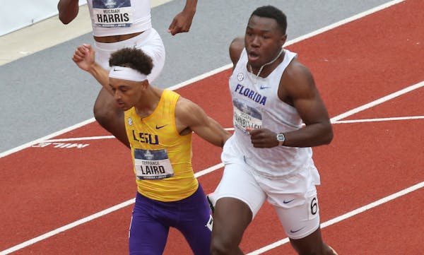 Florida's Joseph Fahnbulleh, right, edges out LSU's Terrance Laire at the finish to win the men's 200 meters