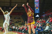 Gophers freshman Grace Grocholski (25) went up for a shot in the first quarter Tuesday at Rutgers.