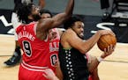 Timberwolves center Karl-Anthony Towns, right, rebounds the ball against Chicago Bulls forward Patrick Williams last month.