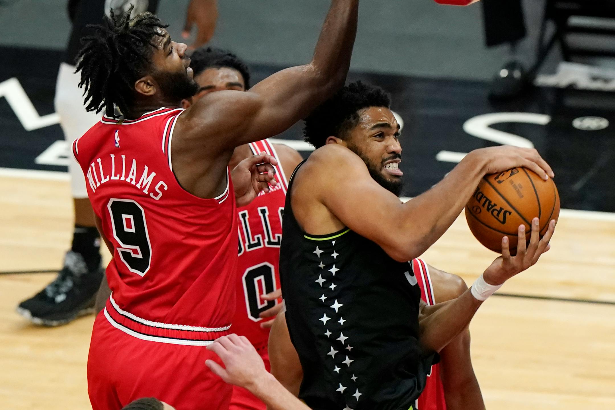 Timberwolves center Karl-Anthony Towns, right, rebounds the ball against Chicago Bulls forward Patrick Williams last month.