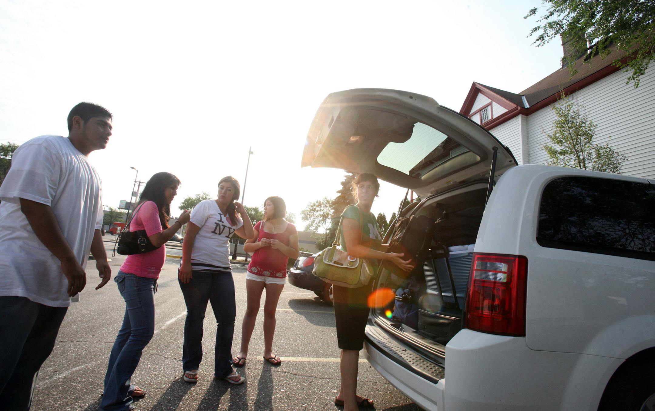 From left David Cruz, Ana Vergara, Teresa Maldonado, and Denise Soriano milled about while Martha Ockenfels-Marinez checked the luggage for bandage before the group hit the road on a civil rights trip through Immigrant Freedom Network.
