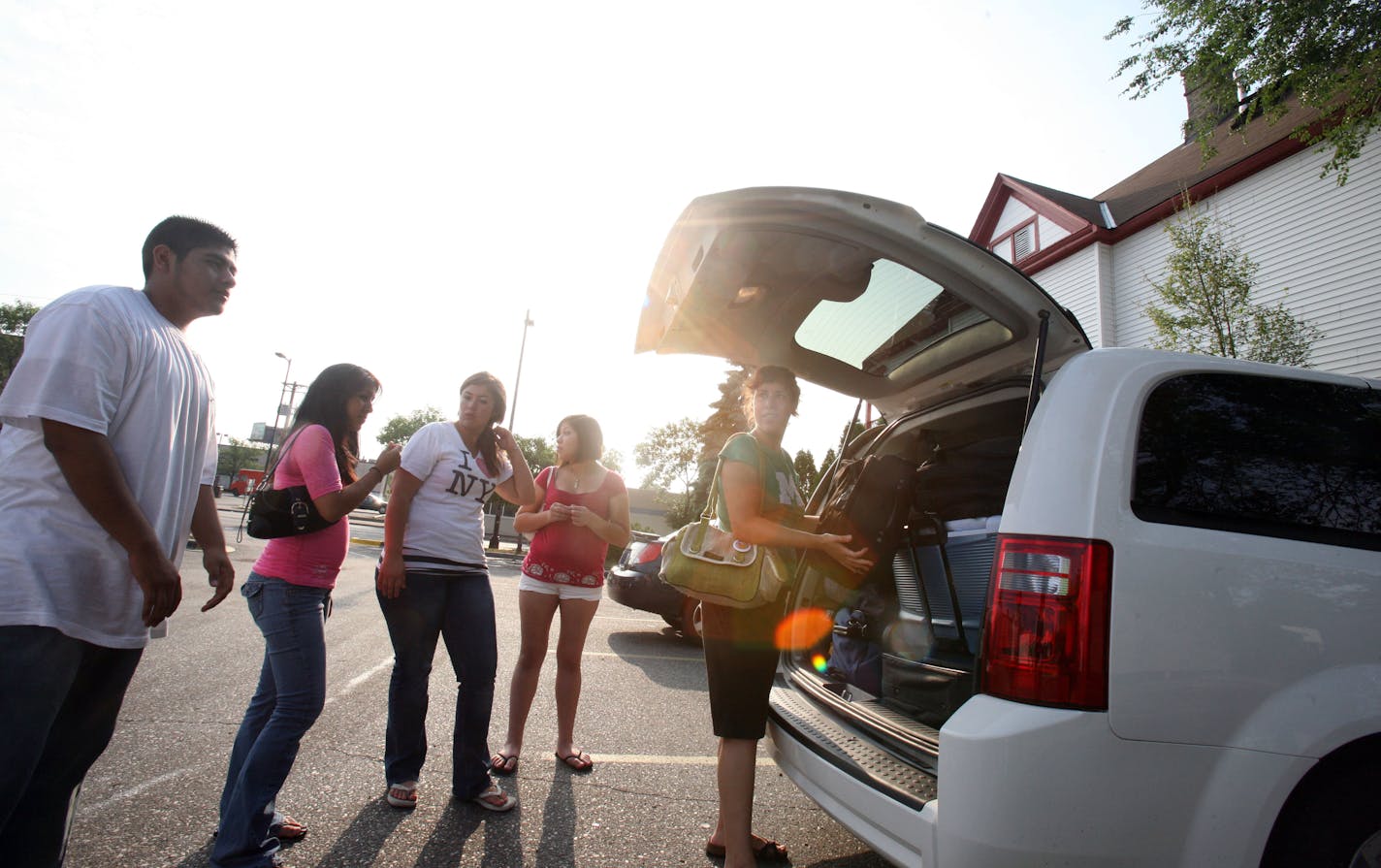 From left David Cruz, Ana Vergara, Teresa Maldonado, and Denise Soriano milled about while Martha Ockenfels-Marinez checked the luggage for bandage before the group hit the road on a civil rights trip through Immigrant Freedom Network.