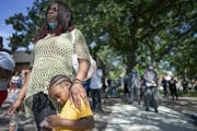 Ebony Chambers with her son Damian Kohel Jr., 4, attended a meeting at North Commons Park to discuss problems and solutions with the Minneapolis Polic