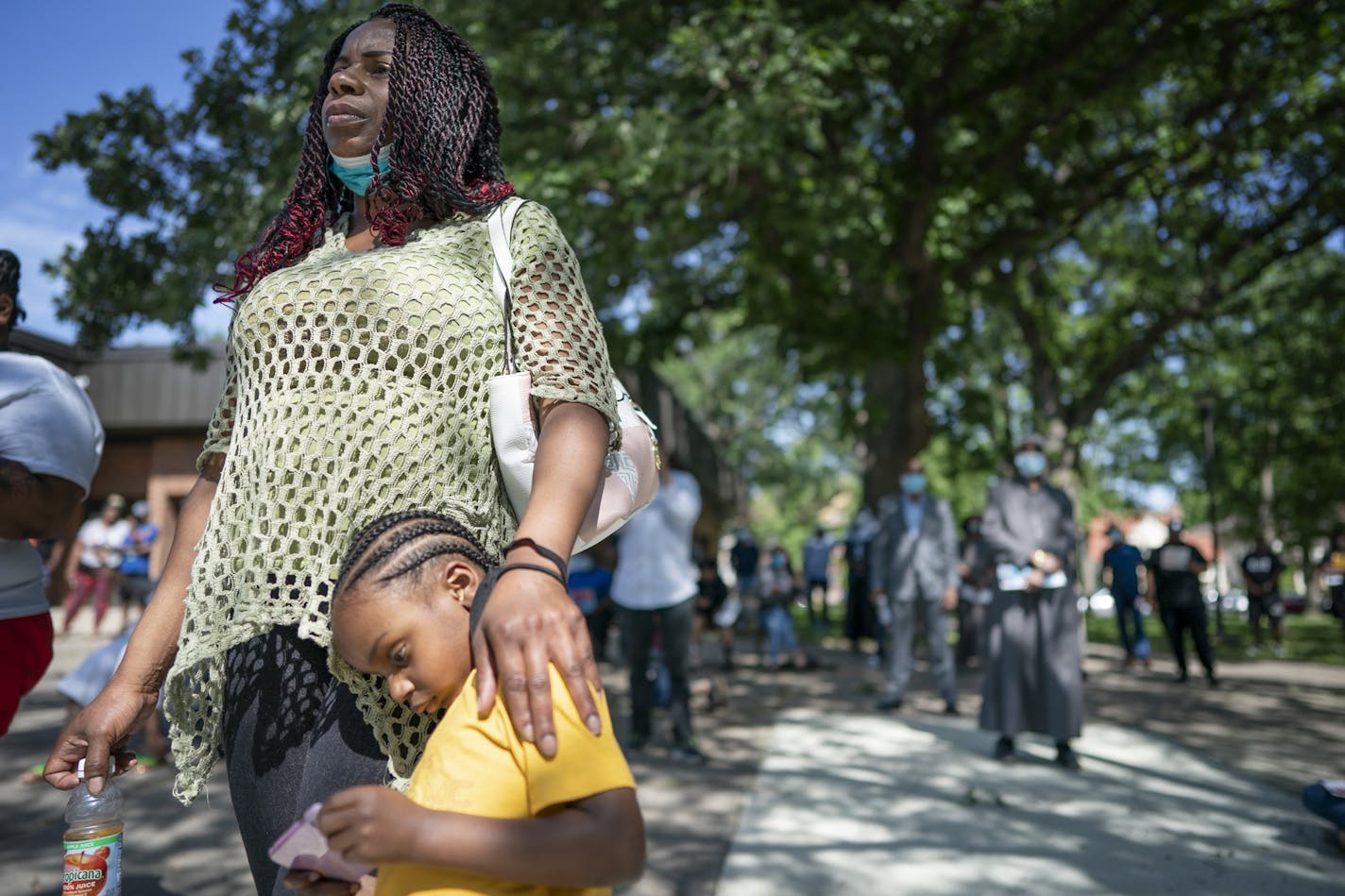 Ebony Chambers with her son Damian Kohel Jr., 4, attended a meeting at North Commons Park to discuss problems and solutions with the Minneapolis Police Department with the community.