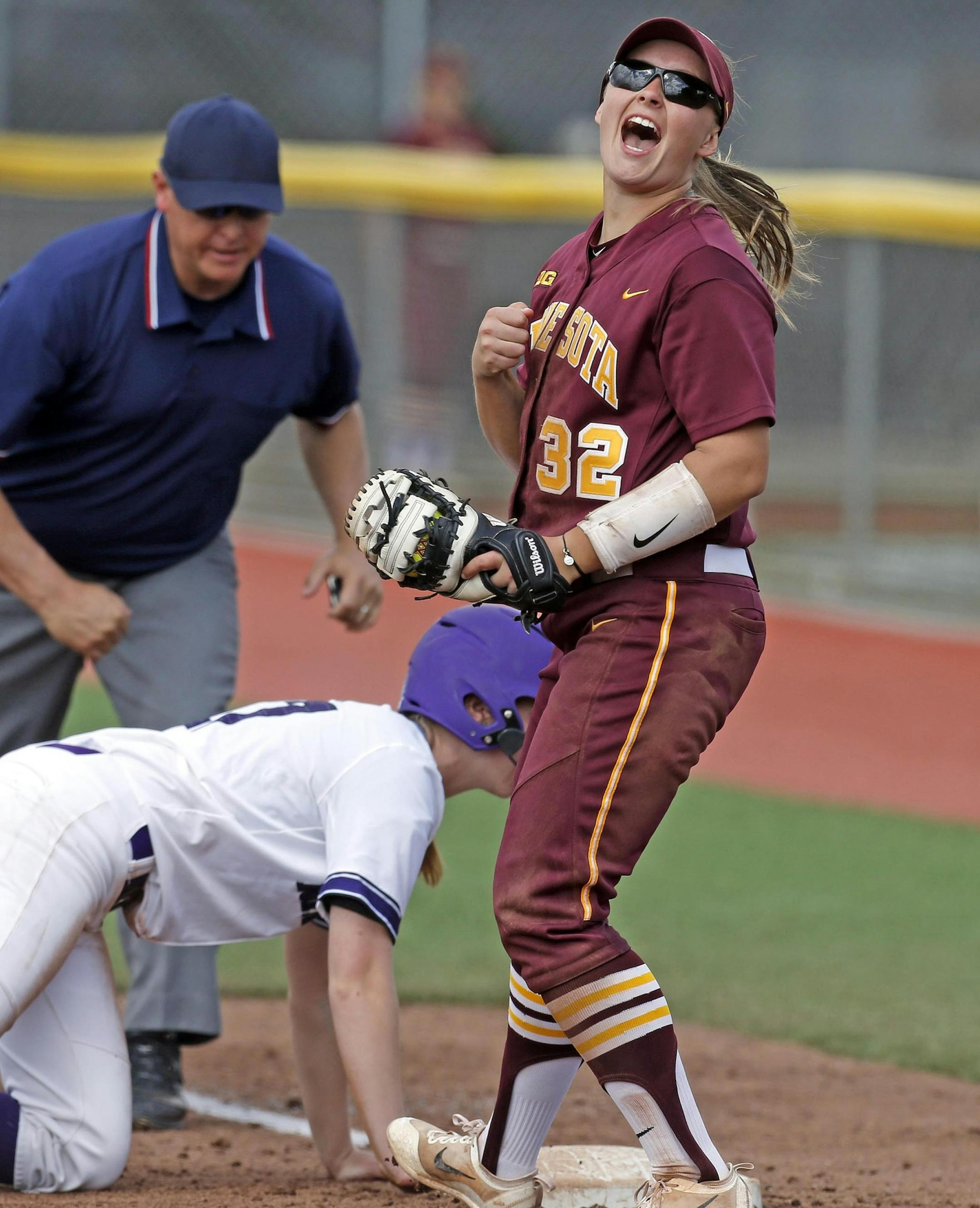 Sydney Dwyer gets a Northwestern baserunner out, April 2017, Gophers softball. University of Minnesota photo.