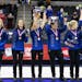 From left, Team Peterson's coach Laine Peters, alternate Aileen Geving, Tara Peterson, Becca Hamilton, Nina Roth and Tabitha Peterson wave to fans dur