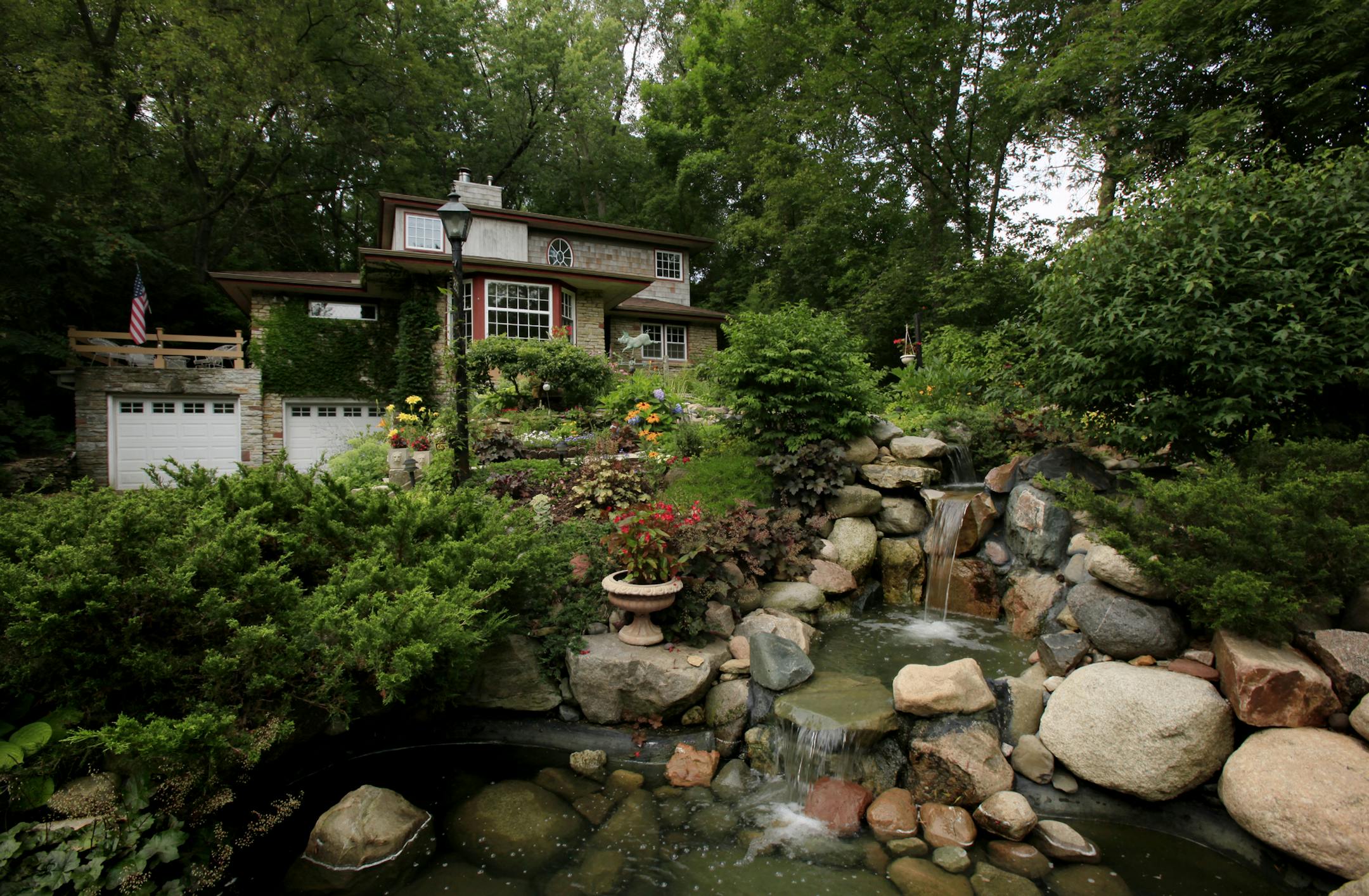 A large waterfall is the focal point of the front yard garden.