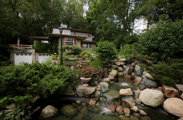 A large waterfall is the focal point of the front yard garden.