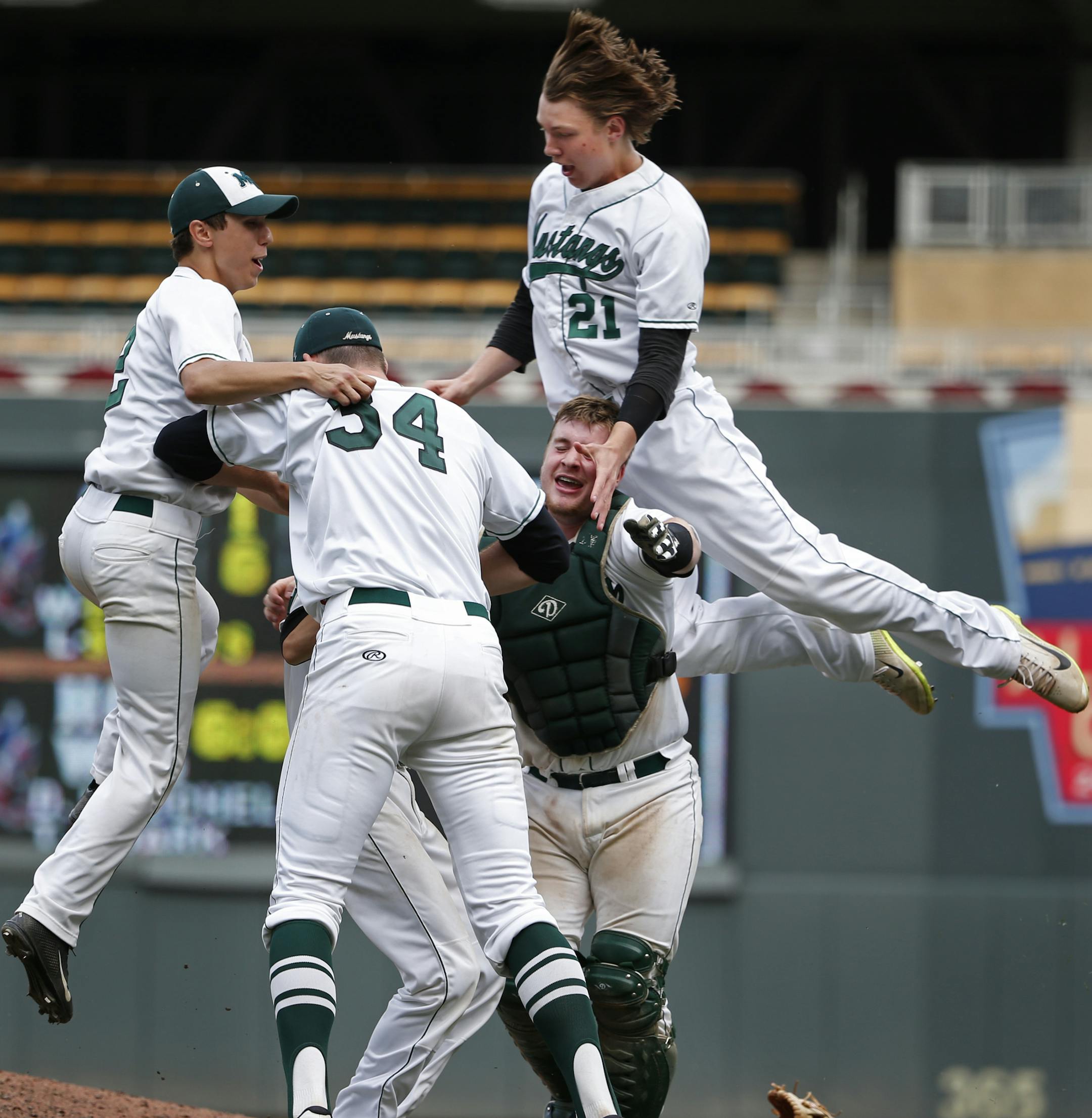In the 3A championship game between Eden Prairie an Mounds View at Target Field on June 17, 2014, Mounds View celebrated its championship including Sam Hentges(34) and catcher Wyatt Meyer(20) and Kellen Rholl(21).]richard.tsong-taatarii/rtsong-taatarii@startribune.com