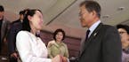 South Koran President Moon Jae-in, right shakes hands with Kim Yo Jong, North Korean leader Kim Jong Un's sister, after a performance of North Korea's