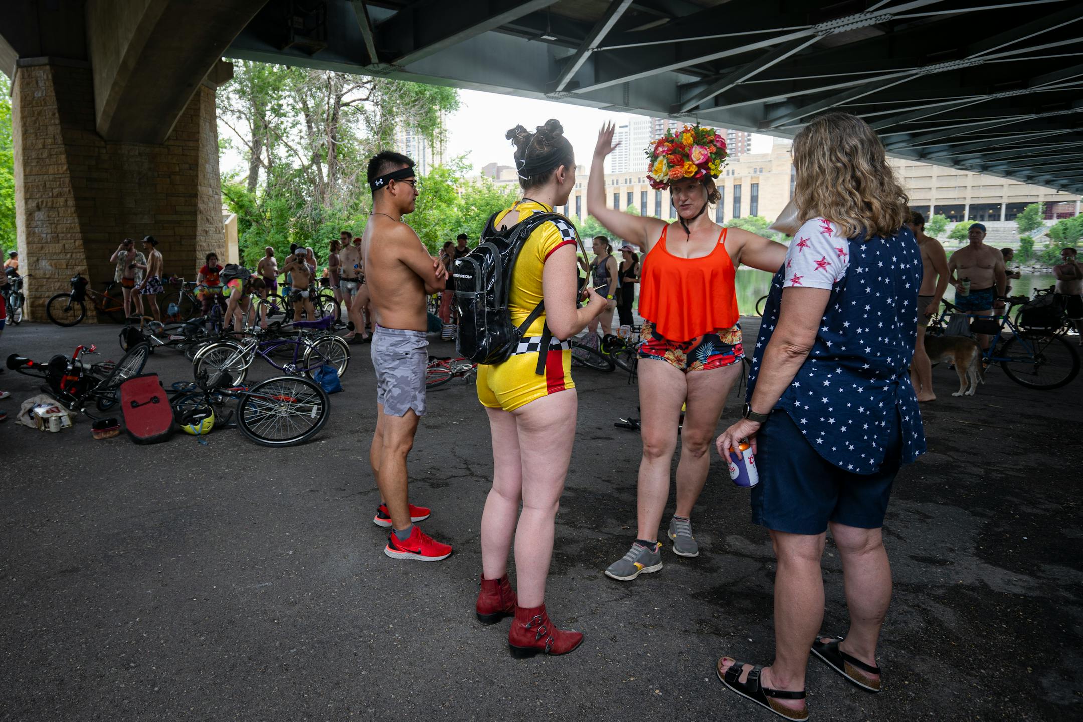 Bicyclists gather under the Hennepin Avenue Bridge before the annual Freedom From Pants Ride.
