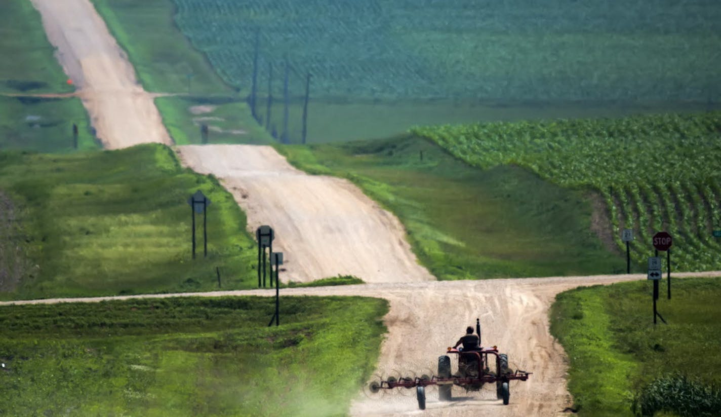 The Minnesota landscape of the South West that was predominately tall grass prairie before settlement is now a patchwork of farm fields and rolling dirt roads. ] Minnesota State of Wonders - Summer on the Prairie. BRIAN PETERSON &#x2022; brian.peterson@startribune.com Luverne, MN 08/02/14 ORG XMIT: MIN1408071218243713