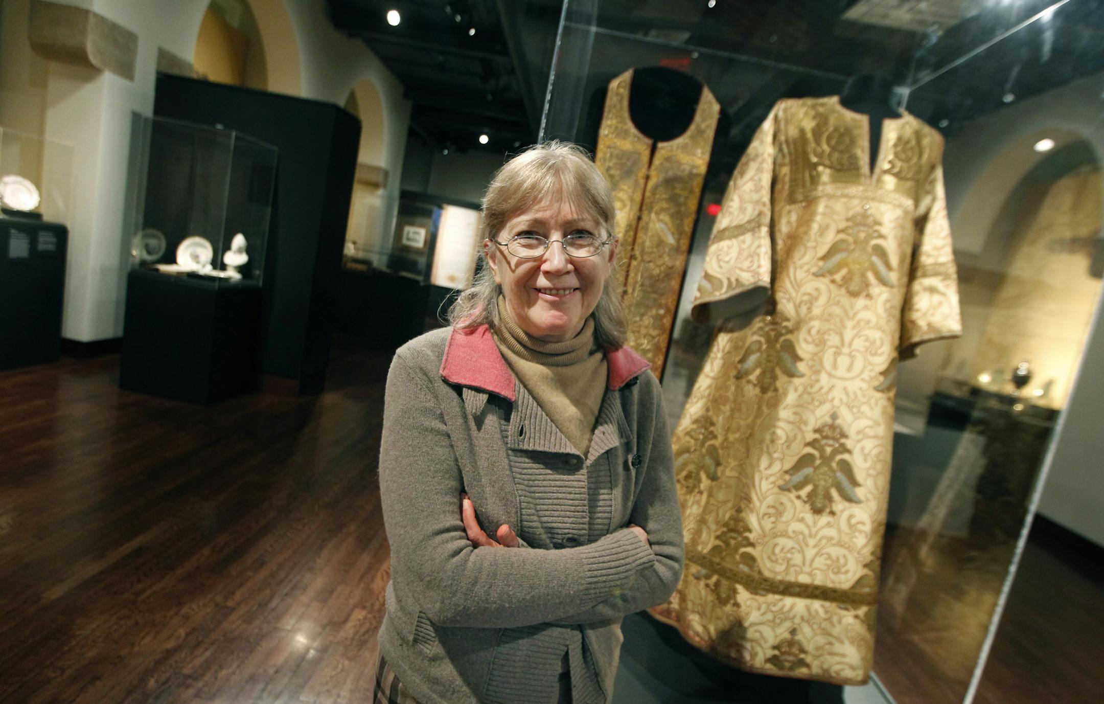 Curator Masha Zavialova prepared "The Romanovs: Legacy of an Empire Lost," at the Museum of Russian Art, Friday, November 15, 2013. The show is of memorabilia of three centuries of costumes, photos, paintings, books, jewelry from 15 museums and private collections, documenting the history of Russia's czars whose rule ended in bloody revolution of 1917. (ELIZABETH FLORES/STAR TRIBUNE) ELIZABETH FLORES • eflores@startribune.com