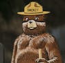 A Smokey Bear "Very High" fire danger sign is posted at the entrance to Griffith Park in Los Angeles Thursday, Sept. 10, 2015. Much of California simm