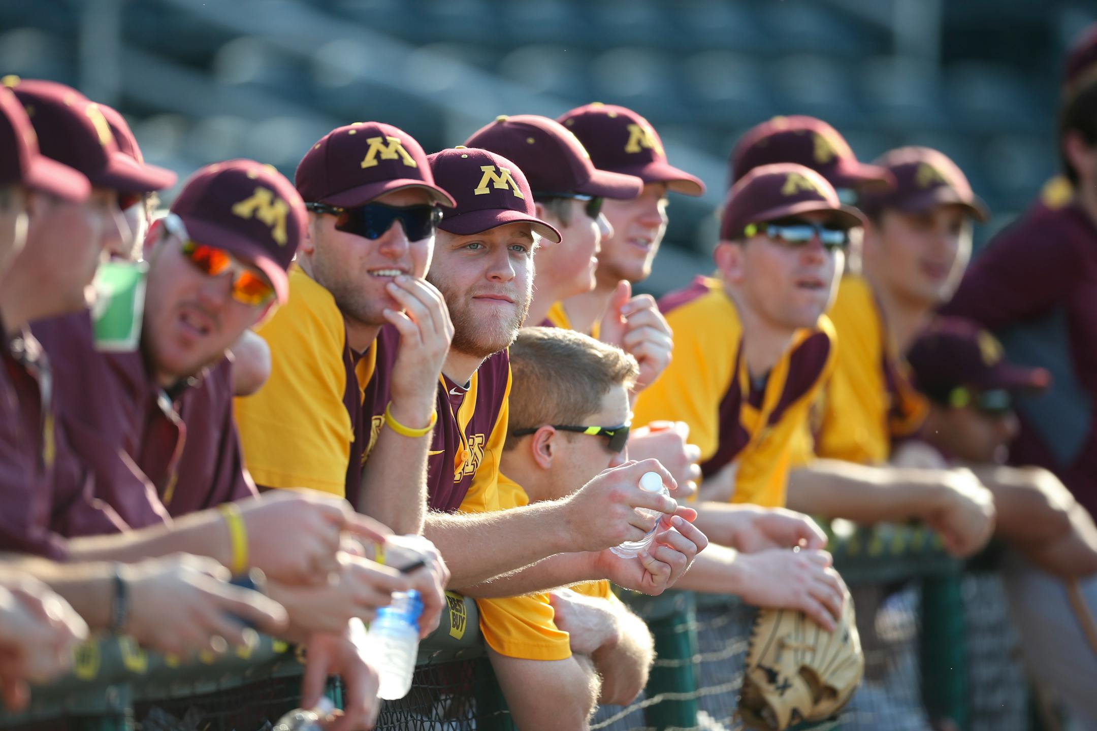 Gophers players watched as the Twins took batting practice before their exhibition game against the Twins in March.