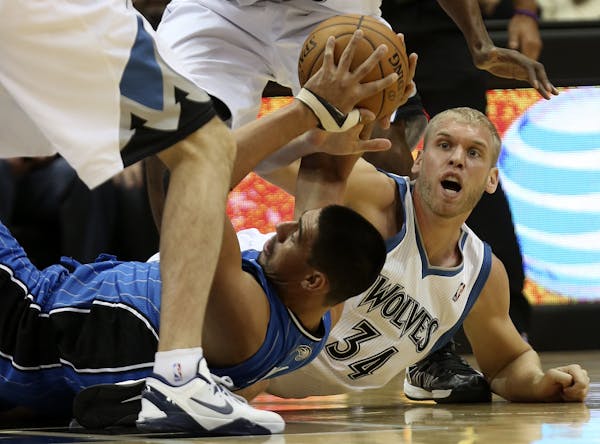 Greg Stiemsma fought for possession of the ball with the Magic's Gustavo Ayon.