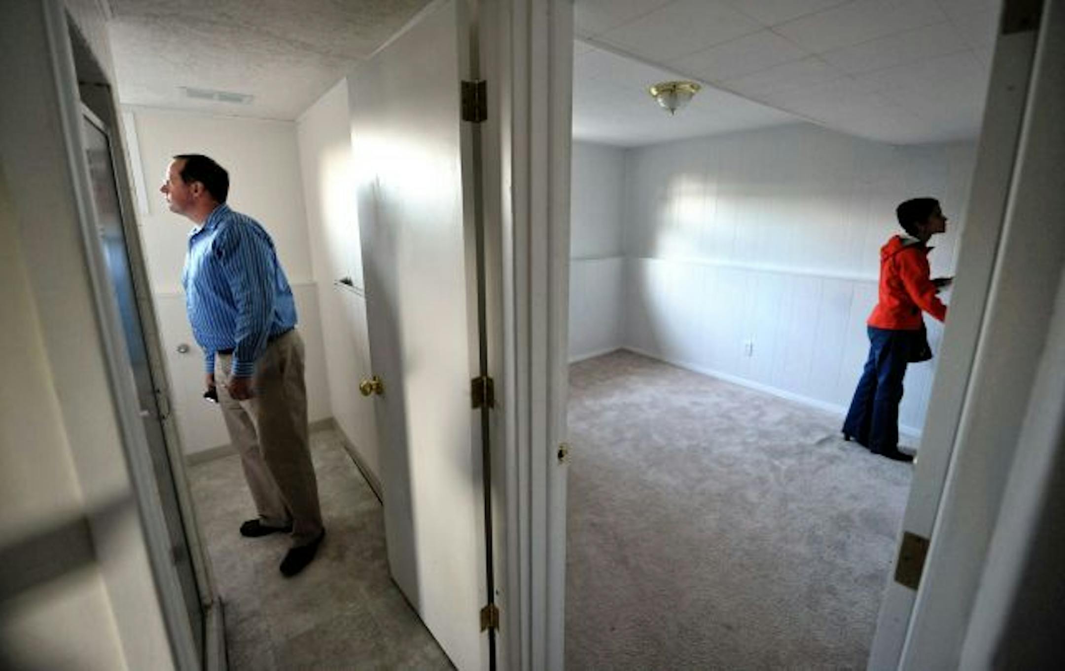 Prospective first-time home buyers Rick Raihle and his wife, Ruth Baires Raihle, toured a home in Apple Valley with Edina Realty real estate agent Jeff Cauble. The Raihles are hoping to cash in on an $8,000 tax credit.
