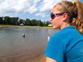 A lifeguard watched over swimmers at the Lake Elmo Park Reserve swim pond in 2013.Stifling hot weather is expected to draw thousands to the manufactur