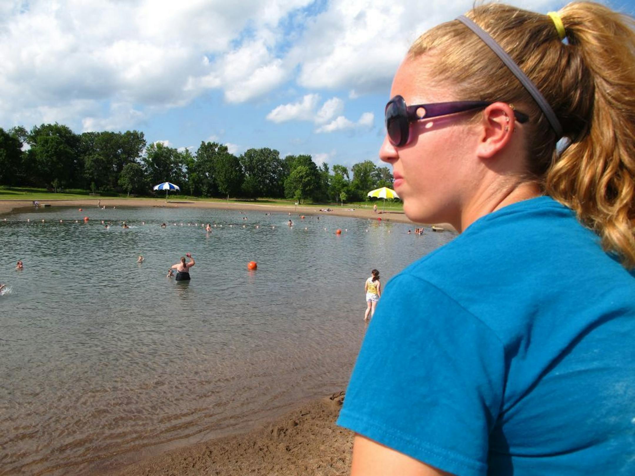 A lifeguard watched over swimmers at the Lake Elmo Park Reserve swim pond in 2013.Stifling hot weather is expected to draw thousands to the manufactured pond where 6-year-old Ghia Vue was found lifeless in shallow water last weekend.