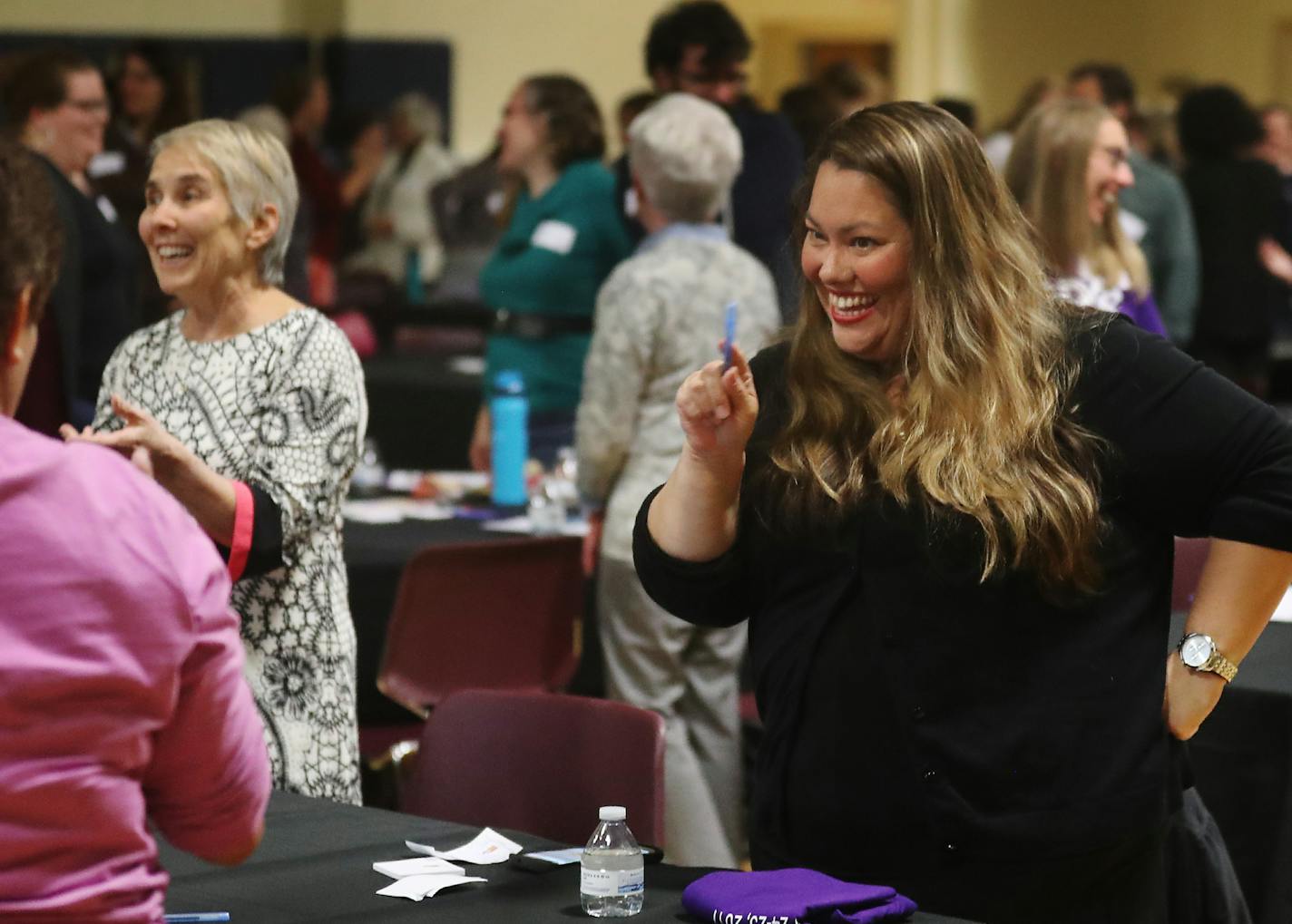 The Quality Parenting Initiative kick-off for Minnesota began Tuesday, Oct. 24, 2017, at the Wellstone Center in St. Paul, MN. Here, Jennifer Rodriguez, the executive director of the Youth Law Center in California, right, joined some of the nearly 200 people on hand, in greeting those around them, before embarking on the two-day event to come up with solutions to improve the quality of Hennepin County's foster care system.] DAVID JOLES &#xef; david.joles@startribune.com About 200 people are emba