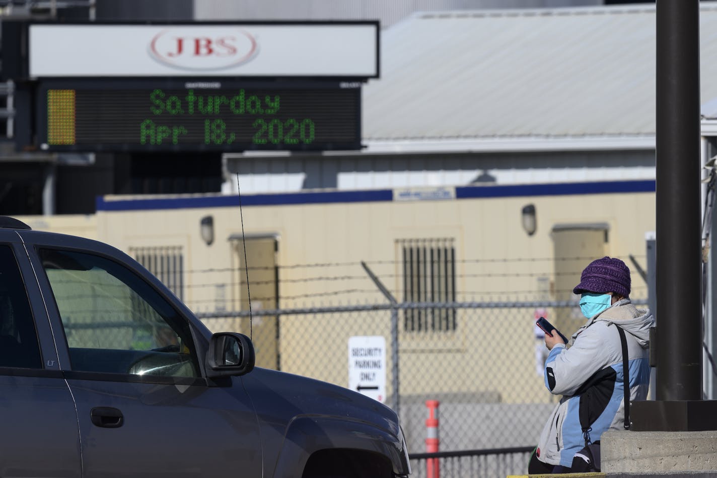 Workers departed the JBS Worthington pork plant donning face masks at the end of their shift Saturday afternoon.