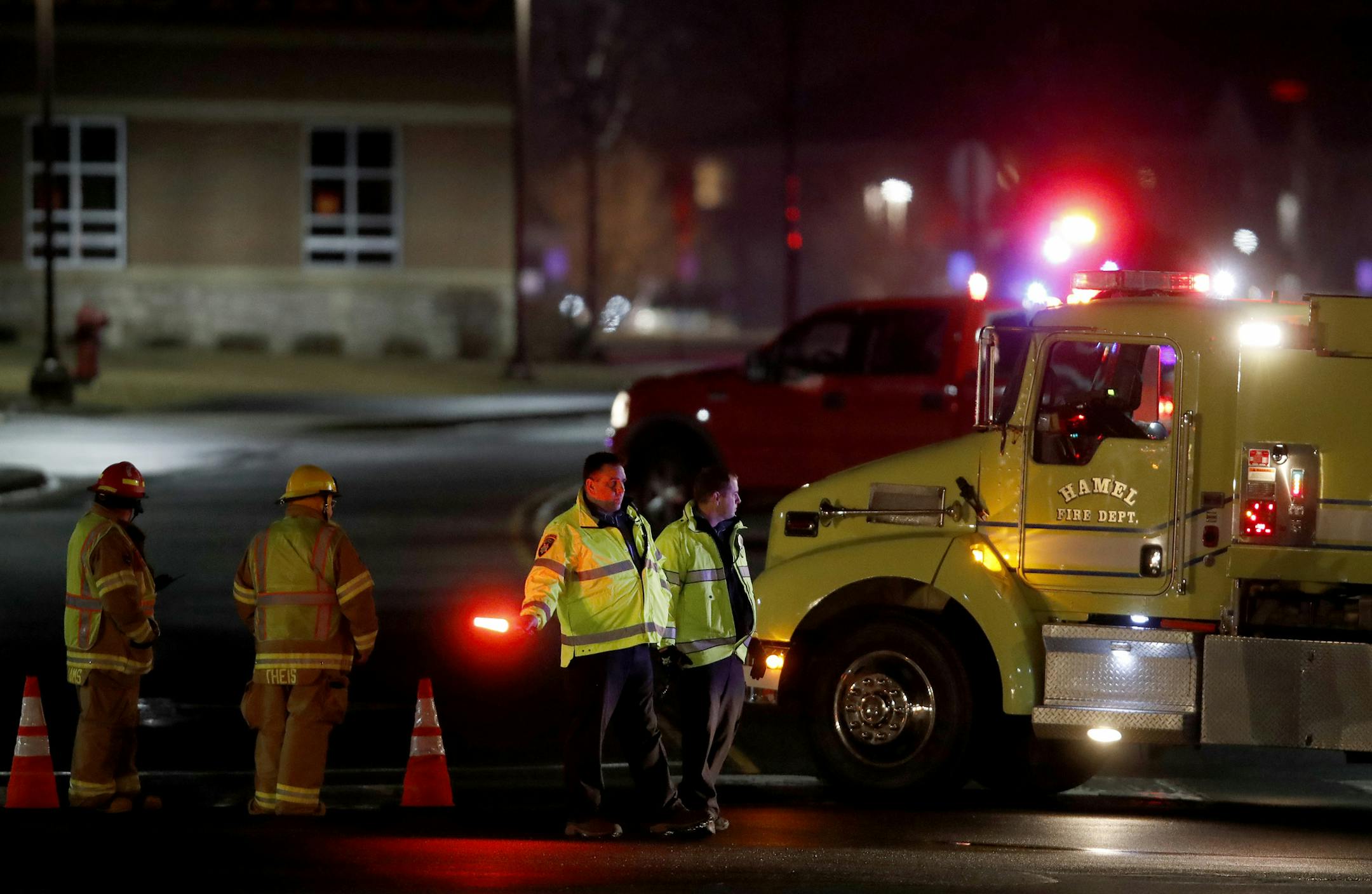 Emergency crews stood near the parking entrance to Target in Medina. Target and surrounding stores in Medina were evacuated because of a bomb threat on Sunday evening, March 26.