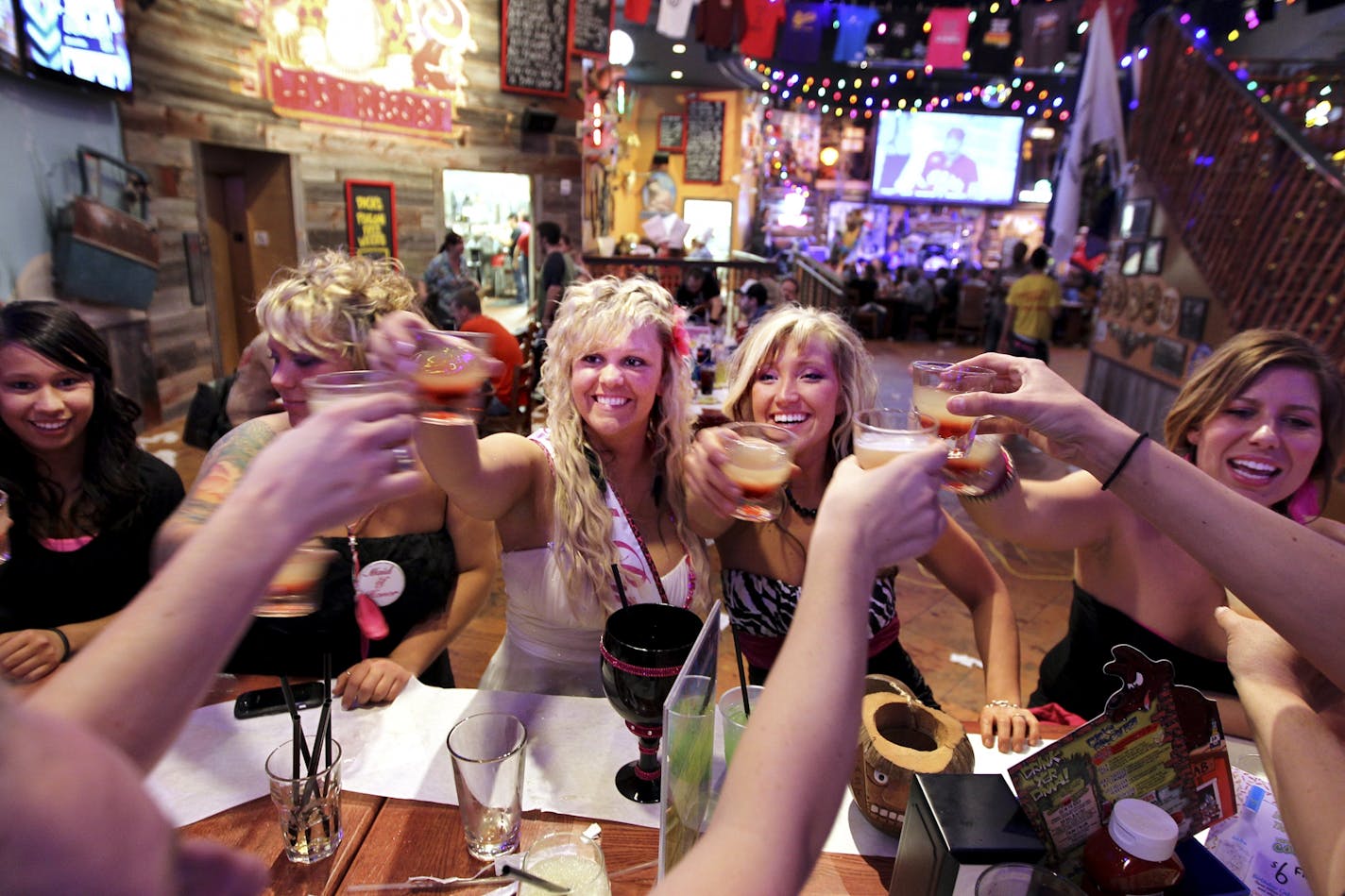 Bride-to-be Megan Brathall, 25, center, of New Richmond, WI, brought her bachelorette party to Dick's Last Resort restaurant in the Mall of America in Bloomington because it sounded like fun February 4, 2012. Amber Rode, second from right, of River Falls, WI, proclaimed the group "raunchy" and impossible to offend. "We'll probably make the waiter blush," said Brathall.