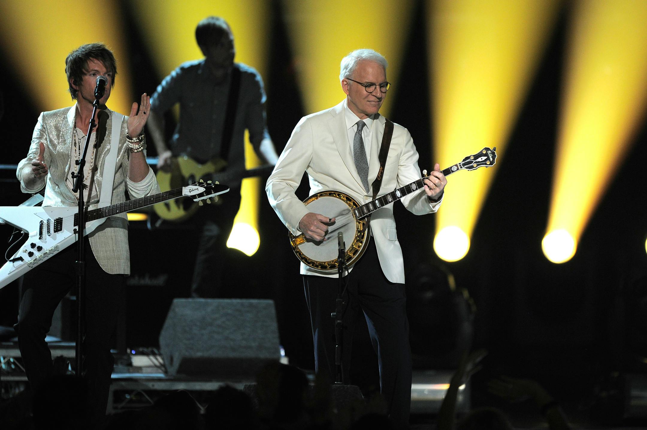 Steve Martin, right, and musical group Rascal Flatts' Joe Don Rooney, left, perform at the 47th Annual Academy of Country Music Awards on Sunday, April 1, 2012 in Las Vegas.