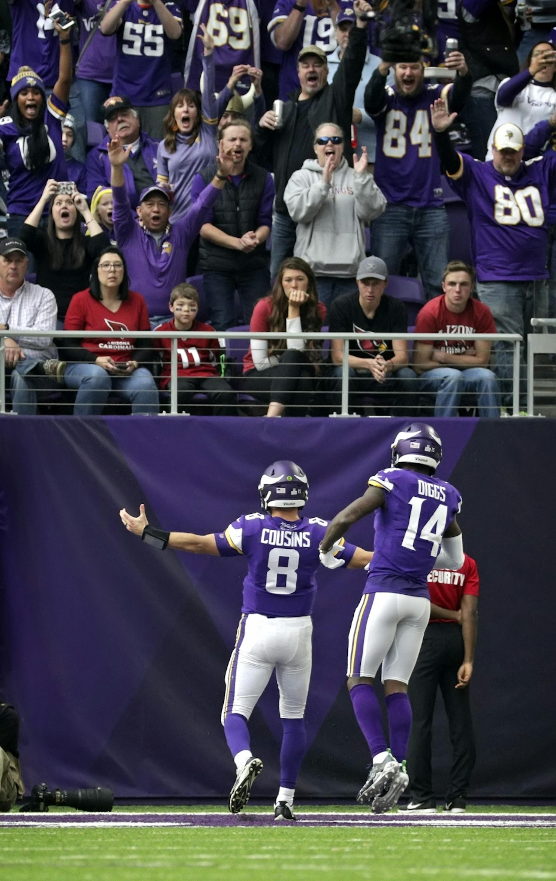 Vikings quarterback scored his first TD as a Viking in the 3rd Quarter. Arizona fans in the front row were not too happy.
