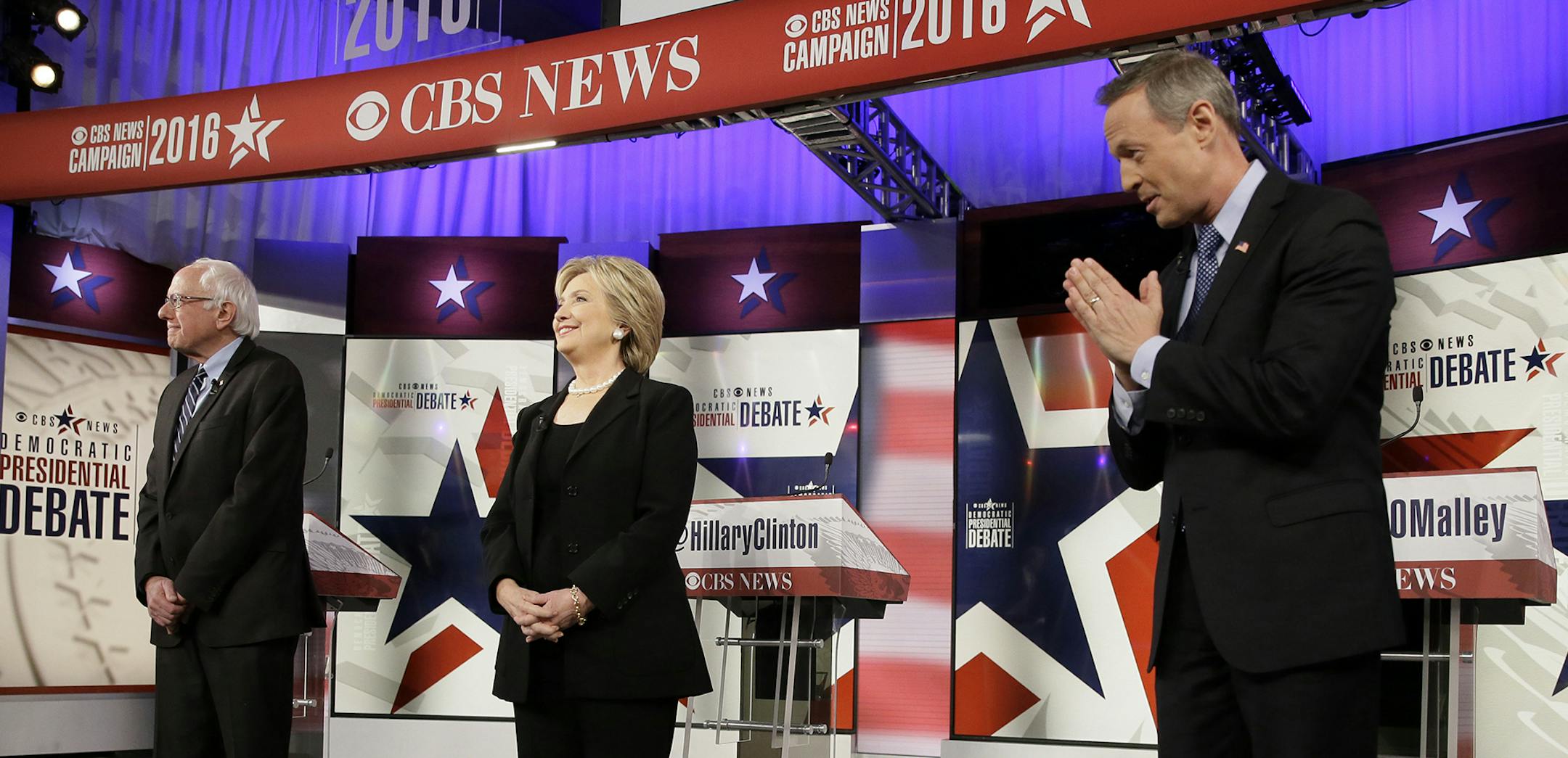 Democratic presidential candidates Bernie Sanders, left, Hillary Rodham Clinton and Martin O'Malley take the stage before a Democratic presidential primary debate, Saturday, Nov. 14, 2015, in Des Moines, Iowa. (AP Photo/Charlie Neibergall) ORG XMIT: MIN2015111815532260